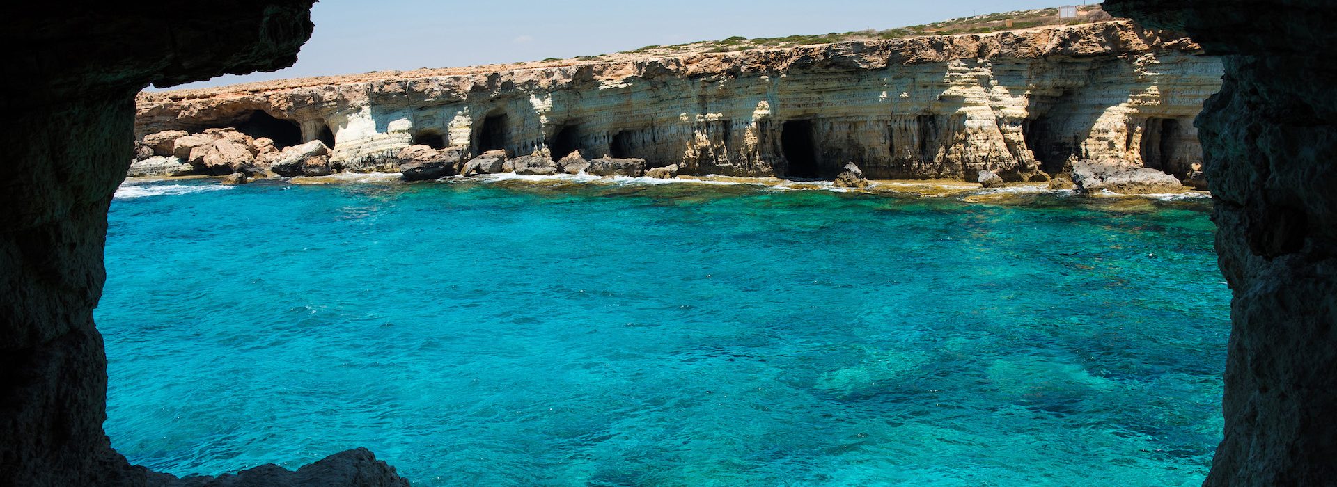 Sea caves (littoral caves) near Ayia Napa, Mediterranean sea coast, Cyprus. They are formed primarily by the wave action of the sea